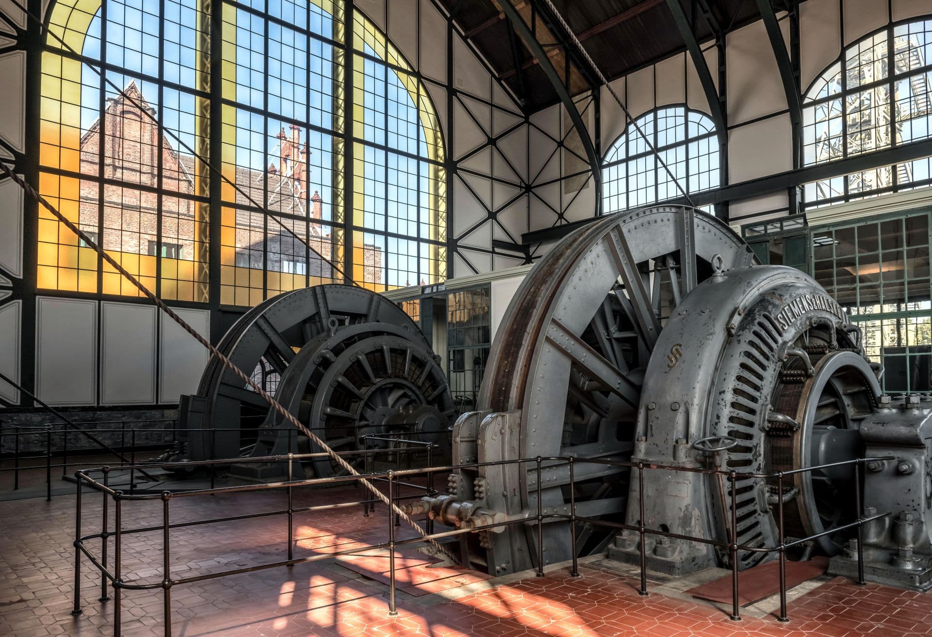 Rotating generator machines on the floor of a power station hall